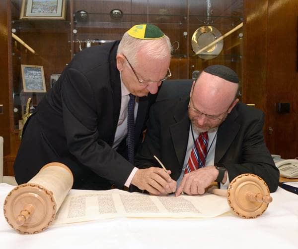 President of Israel Holds the Hand of the Sofer as he Finishes the Last Words of the Torah
